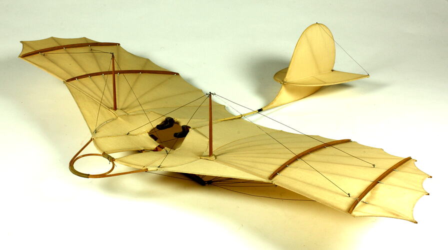 Model of off-white glider. Three quarter front left view.