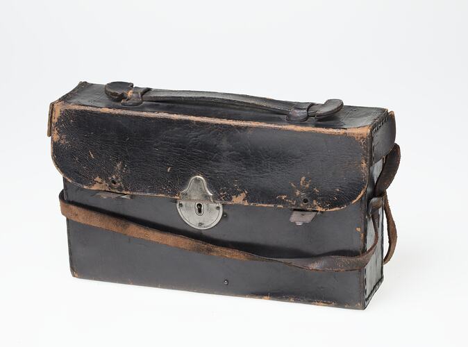 Dark brown (black faded?) leather camera carry case with strap. Metal clasp at front.