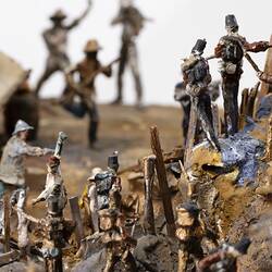Detail of model of figurines representing soldiers and miners engaged in fighting.