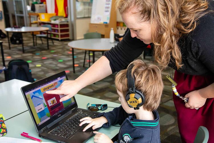 Digital Photograph - Teacher Guiding Child In Computing, May 2020