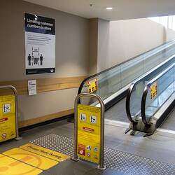 Digital Photograph - Signage Next to Escalator Outside Entrance to Woolworths, Blackburn South, 25 May 2020