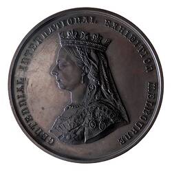 Round medal with Queen Victoria facing left wearing crown and veil, text around.