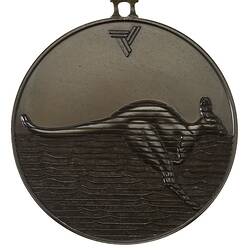 Medal with kangaroo (its body crossed by horizontal lines) leaping right above water. Triangular logo above.