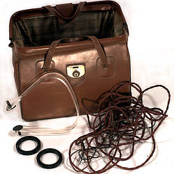 Electro-Convulsive Therapy Machine with brown doctor's bag.