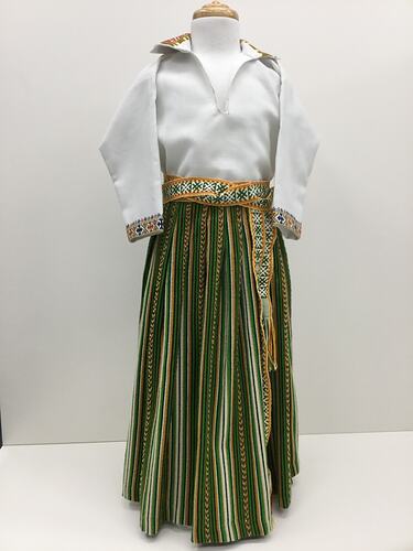 Long sleeve cream shirt with colourful embroidered collar and cuffs.