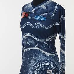 Women's AFLW guernsey with Indigenous pattern in navy and white. Lined and dotted design.