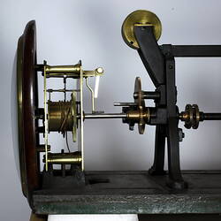 Side view of clock showing mechanism.