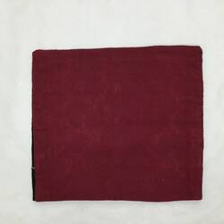 Back of red quare cushion cover.