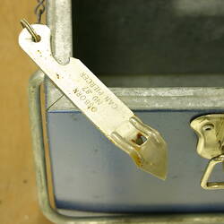 Detail of cooler can piercing tool and metal lock.