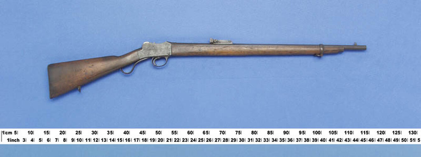 Side view of rifle with measure below.