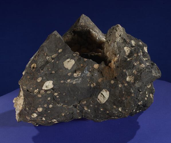 Grey rock with white spots.