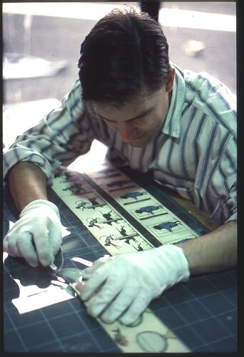 Transparency - Scienceworks, Man with Pre-Cinema Object, Spotswood, Victoria, circa 1991