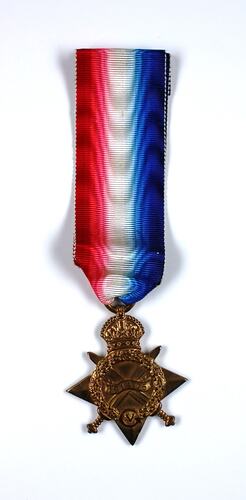 Star shaped medal with crossed swords, wreath and crown and blue, white and red ribbon.