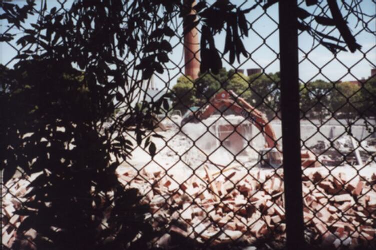 Photograph - Demolition of Kodak Factory Building 20 Through Fence, Kodak Australasia Pty Ltd, Coburg, 2000 - 2001