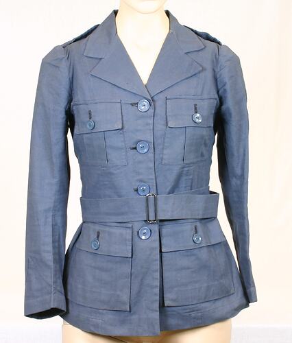 Blue jacket with buttoned breast and hip pockets, shoulder straps and belt.