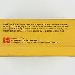 Yellow box with warranty label.