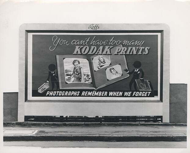 Kodak billboard on footpath.