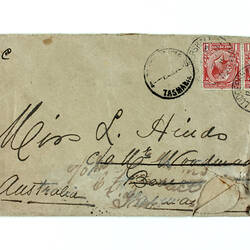 Front of hand-written envelope with red stamp.