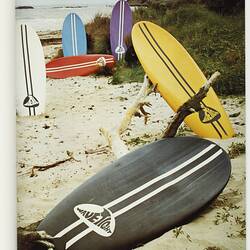 Page with image of Wavetight surfboards on beach.