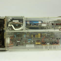 Control box, partially in clear box that shows internal wiring and components.