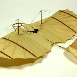 Model of off-white glider. Three quarter left rear view.