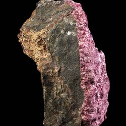Pink crystals on dark rock.