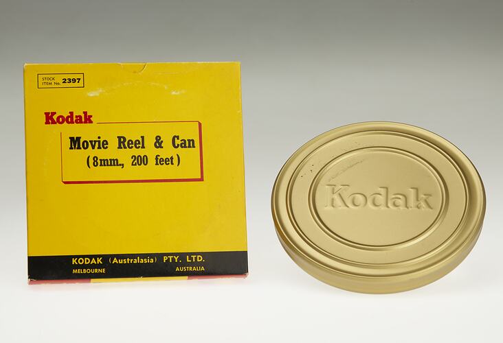 Yellow rectangular box with coppery brown film canister.