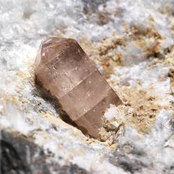 Pink crystal on white rock.