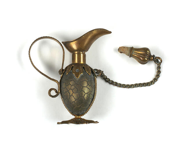 Side view toy brass ewer.