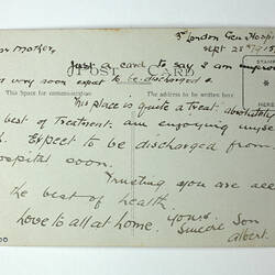 Printed back of postcard with handwriting.