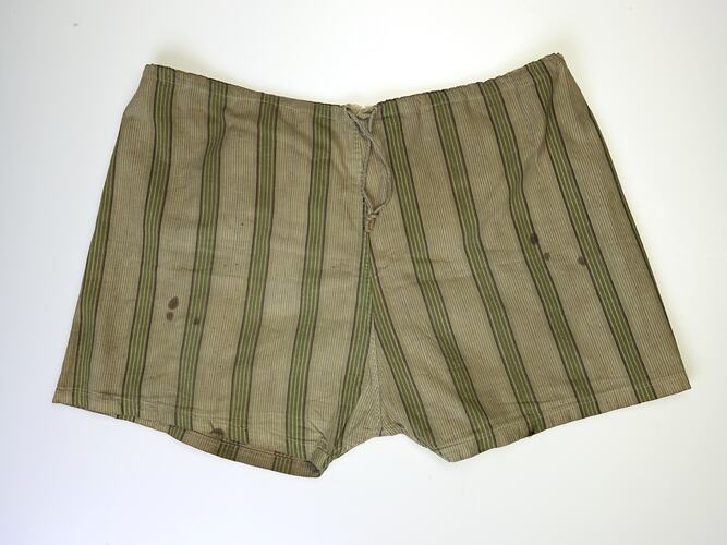 Back of green striped shorts with draw-string.