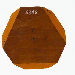 Wooden crystal model in plain timber and orange.