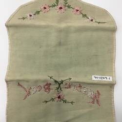 Embroidered needle book, open, showing back side.