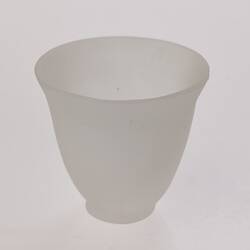 Opaque glass bell-shaped cup. Narrower at base.