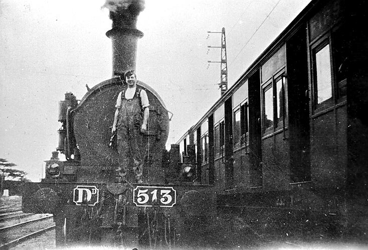 [Staff member on locomotive, Sunshine, 1928.]