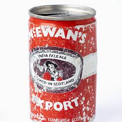 Weathered red steel beer can.