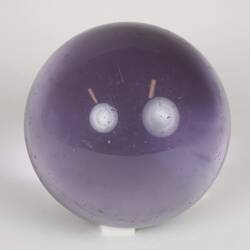 Purple glass sphere.