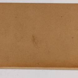 Retangular brown card.