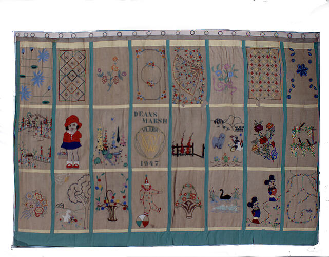 Front of curtains with extensive embroidery.