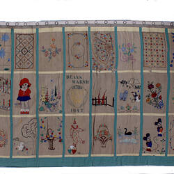 Front of curtains with extensive embroidery.