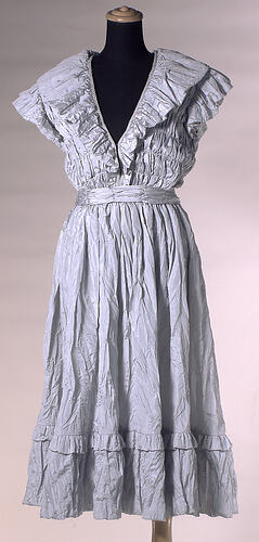 Powder blue evening dress, pleated fabric, ruffled collar.
