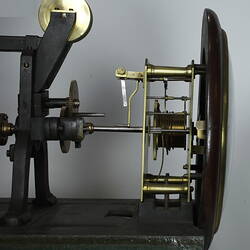 Side view of clock showing mechanism.