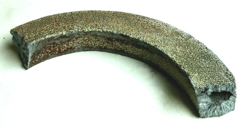 Section of cast, decorative metal.
