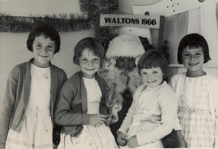 Digital Photograph - Four Girls Sitting with Santa Claus, Walton's Store, Melbourne, 1966