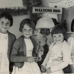 Digital Photograph - Four Girls Sitting with Santa Claus, Walton's Store, Melbourne, 1966