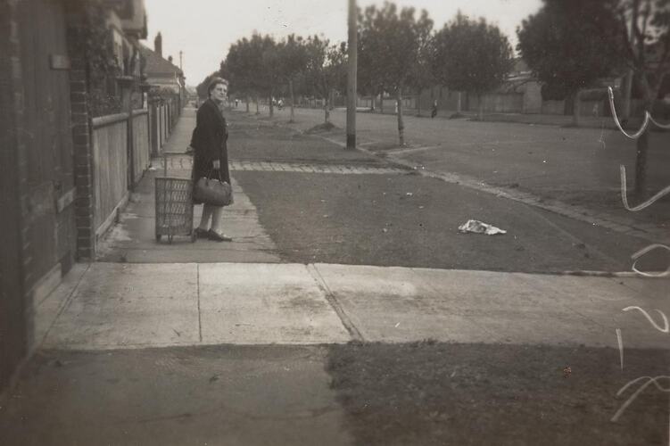 Digital Photograph - Woman with Shopping Cart & Handbag Looking Back Down Street, Middle Park, 1949