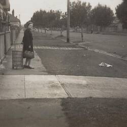 Digital Photograph - Woman with Shopping Cart & Handbag Looking Back Down Street, Middle Park, 1949