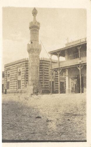 Two buildings with minaret In front.