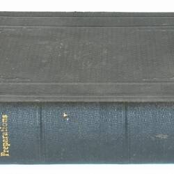 Black cloth-bound secret box book, gold lettering on spine.