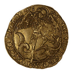 Coin, round, male standing facing with one foot on a dragon which he is spearing in the mouth; text around.